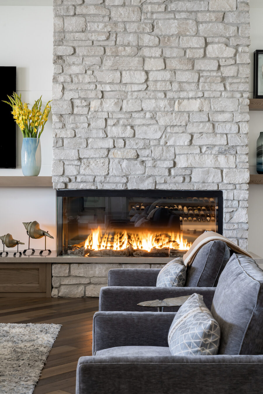 stone-fireplace-design-gray-accent-chairs-living-room